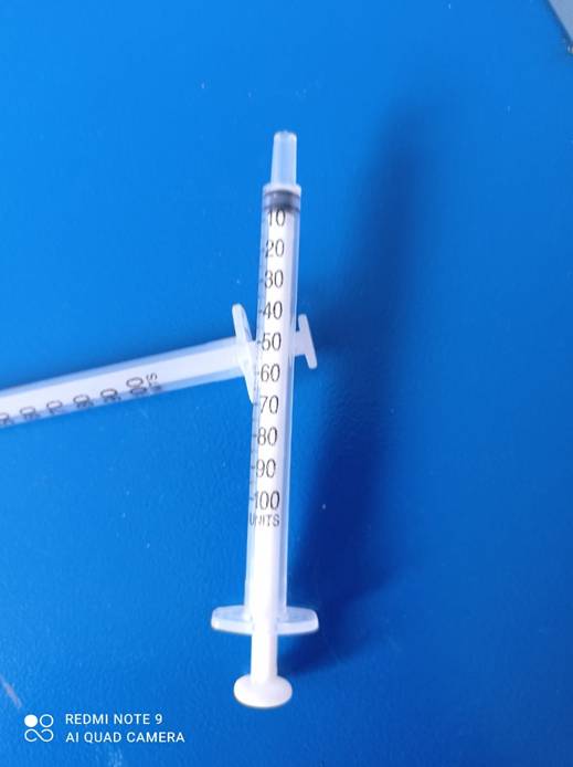 Syringe for vaccination on the floor