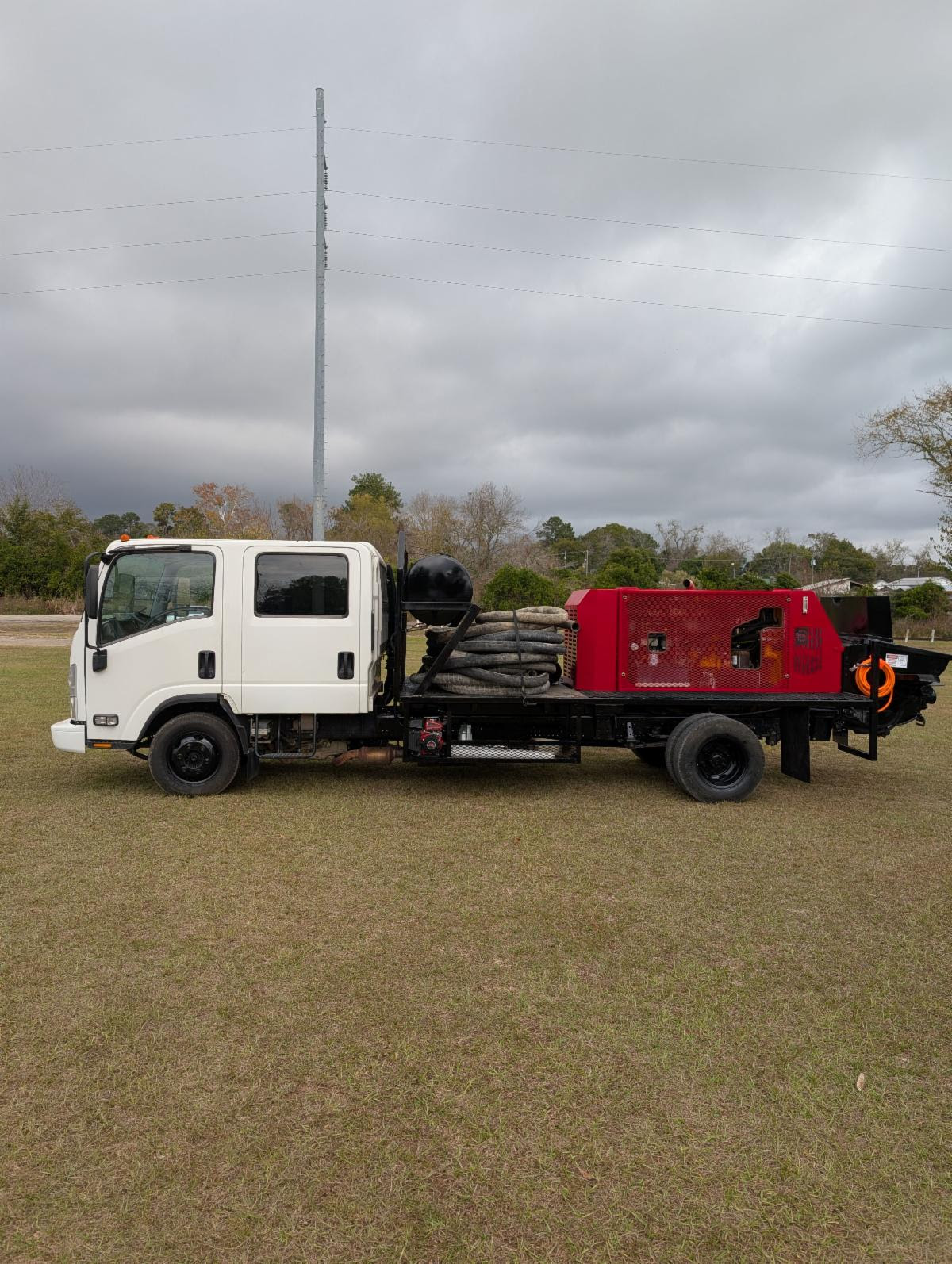 2017 Isuzu NPR-HD Gas Cab & Chassis with 2014 Putzmeister BSA 1005 Concrete Pump, 3,996 Hours